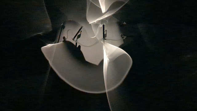 light bending through bending glass to form flame like light beams
