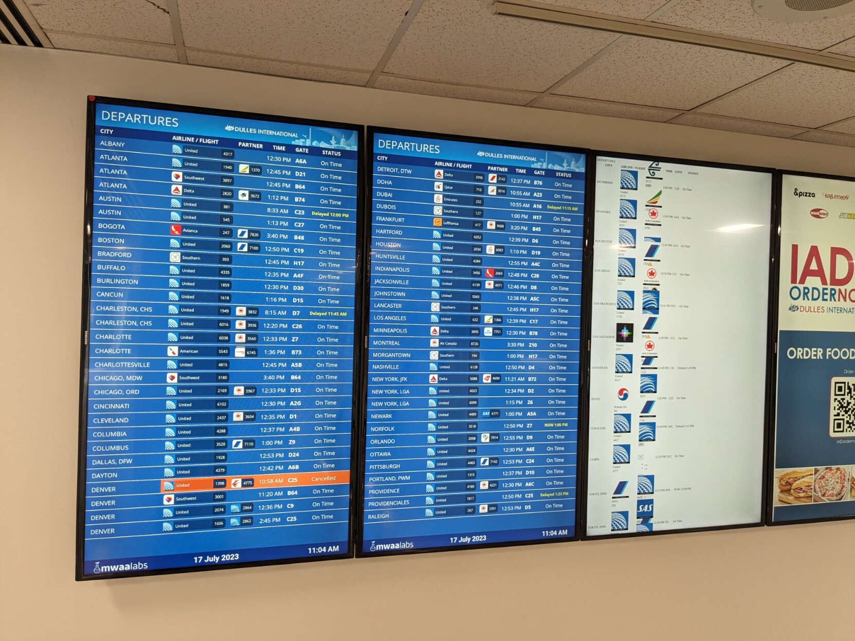 Airport departure board split across three vertically oriented screens, with the content on the right screen (containing the last third of destination cities, alphabetically) appearing to be missing many of its styles, such as background colors and some of the definition of the layout.
