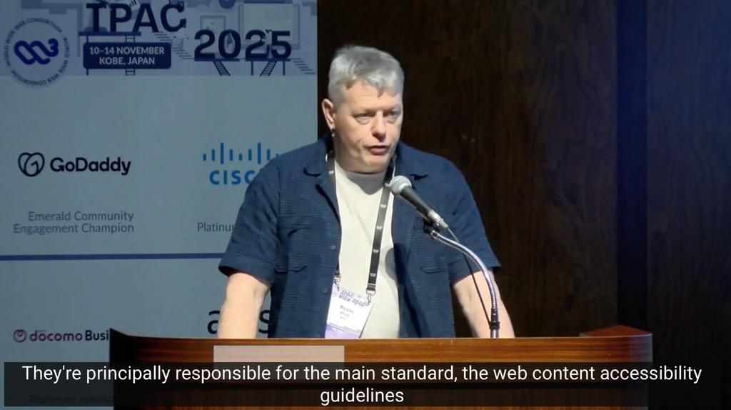 Kevin White presenting accessibility update. caption: "They're principally responsible for the main standard, the web content accessibility guideliens"